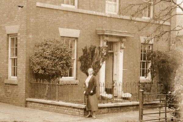 Alice Bealby standing in Front of Brook house