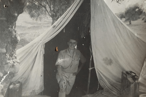 "The tent beneath an olive tree. Kairouan. It looks pitch black in the tent but it isn't really - Kairouan, Tunisia - Aug 1943"