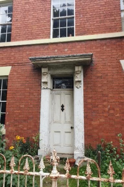 Note the large clam shells either side of door