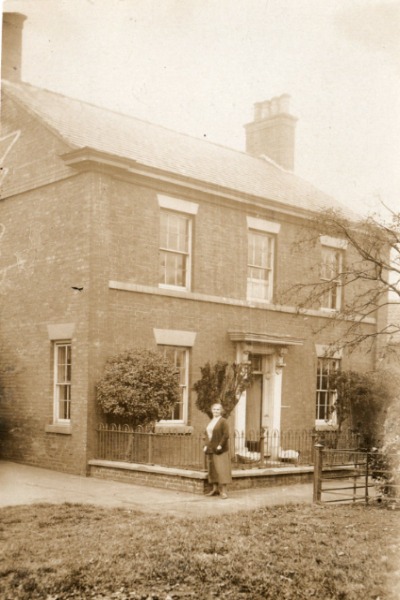 My father's Mother, Alice Bealby, standing outside Brook House. Note the large clams at either side of the front door.
